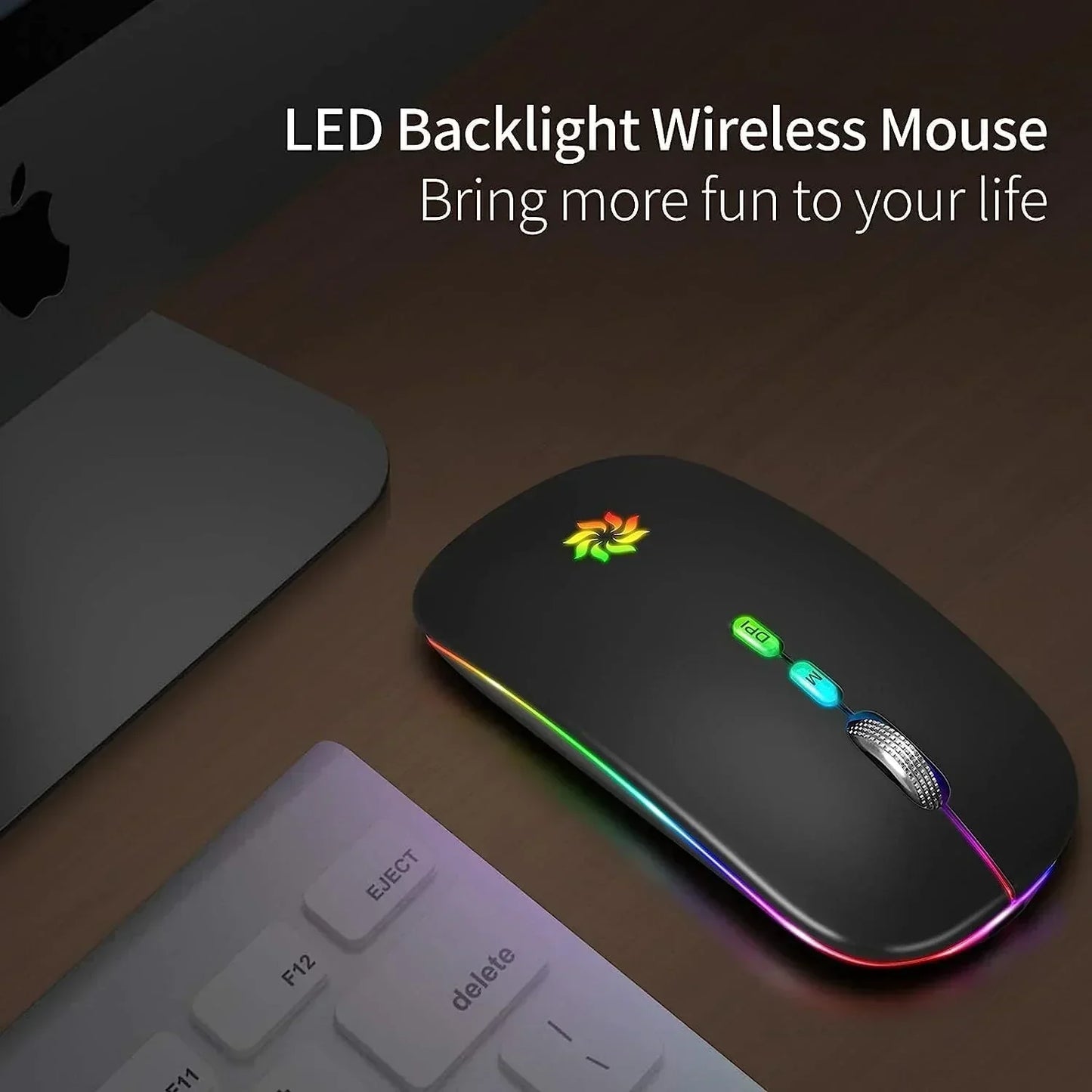 LED backlight wireless gaming mouse with RGB lighting on desk next to keyboard and computer.
