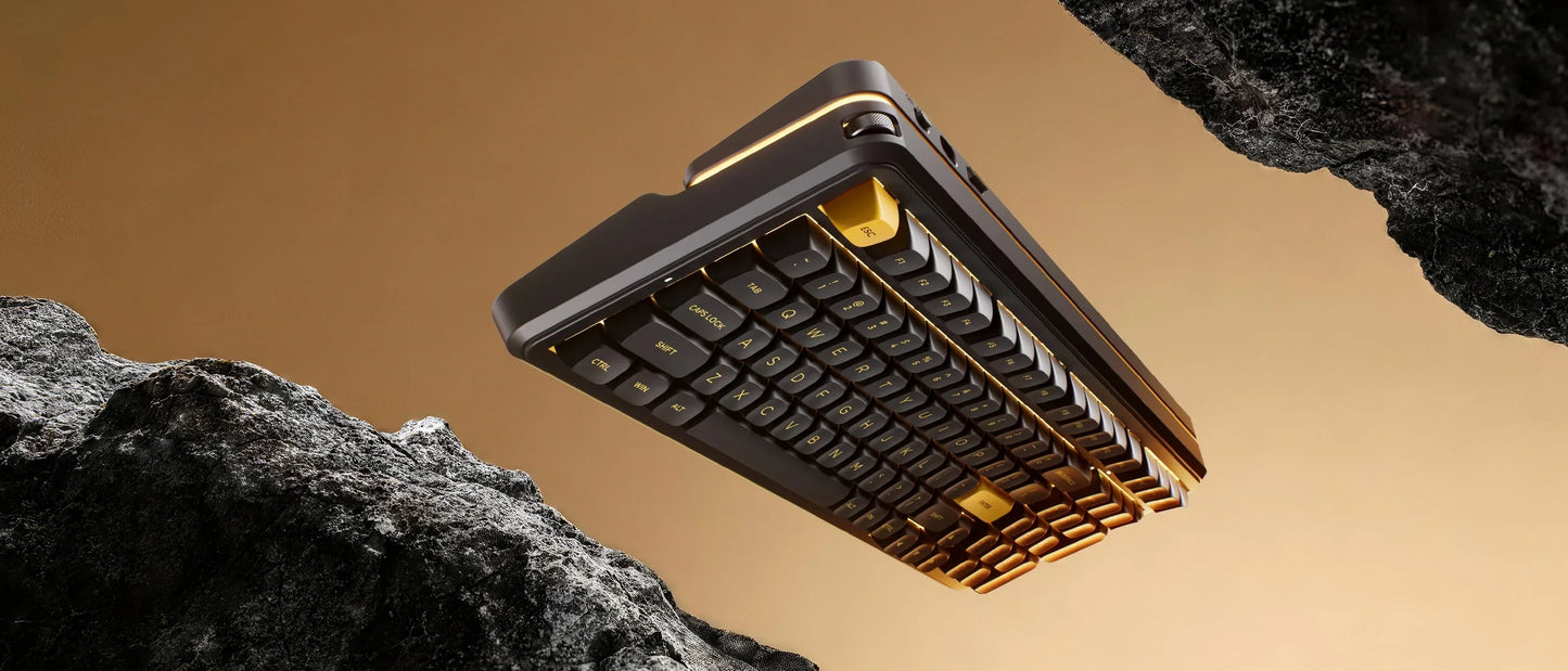 Black and gold gaming keyboard with retro 8-bit design floating between rocks, ideal for PC setup