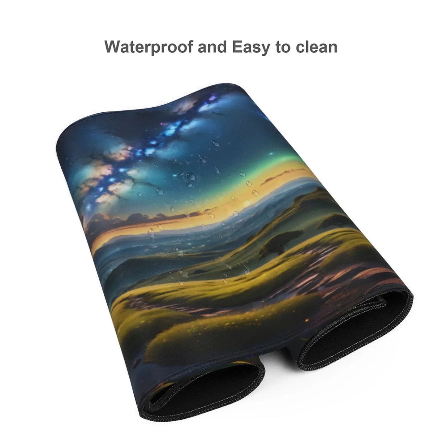Folded waterproof gaming mouse pad with a vivid landscape and starry night sky design, water droplets visible
