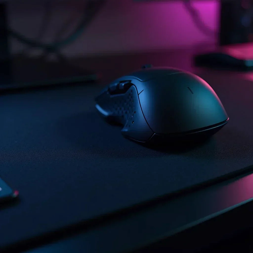 Wireless gaming mouse on a dark desk with RGB lighting, Byte Style modern gaming gear