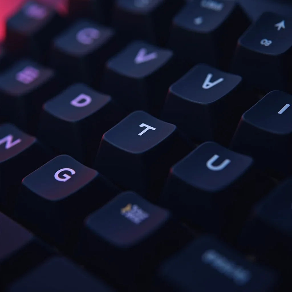Close-up of black mechanical gaming keyboard keys with RGB lighting, Byte Style