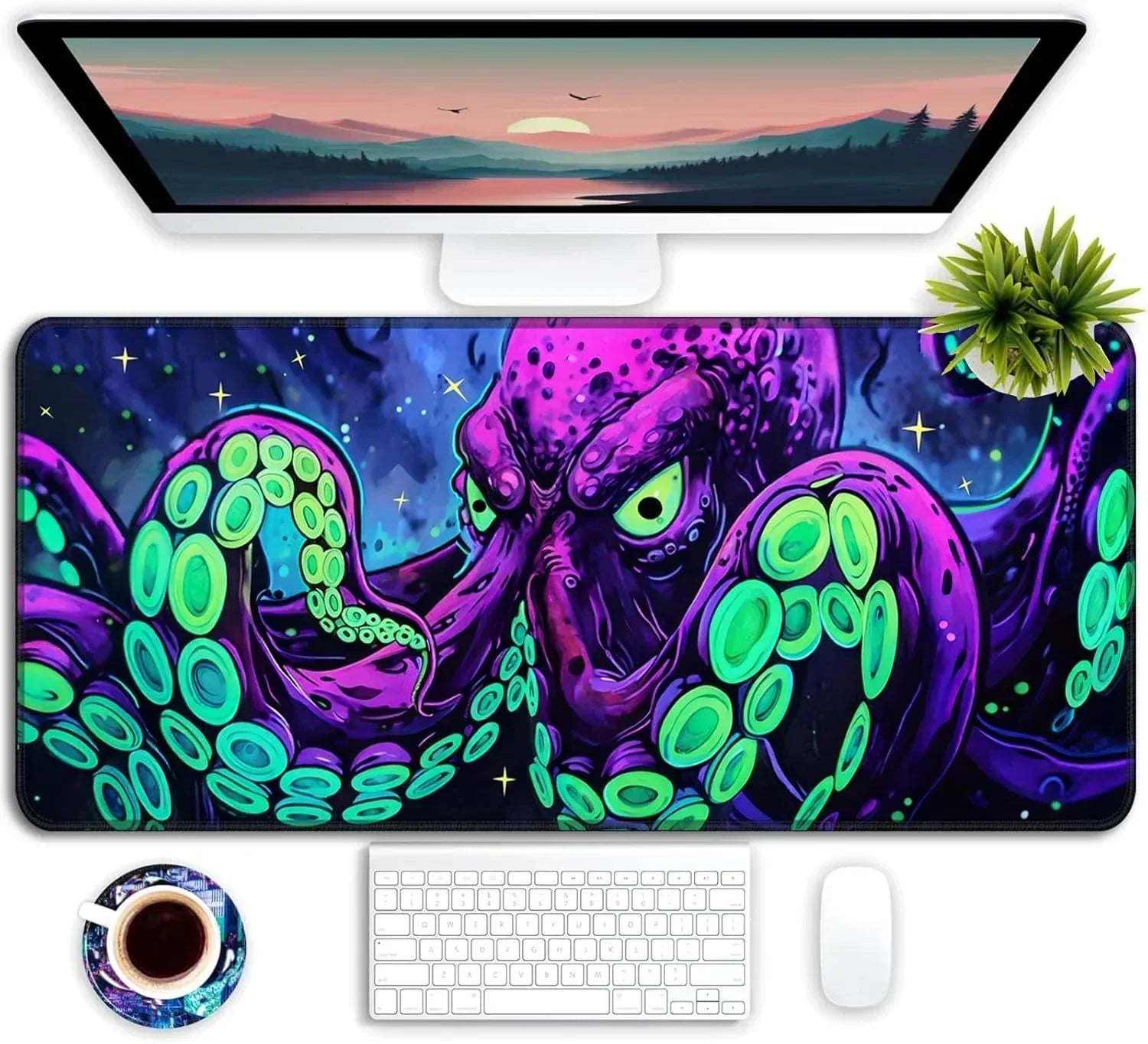 Gaming desk setup with purple and green octopus RGB desk mat, white keyboard and mouse, computer monitor, plant, and coffee cup