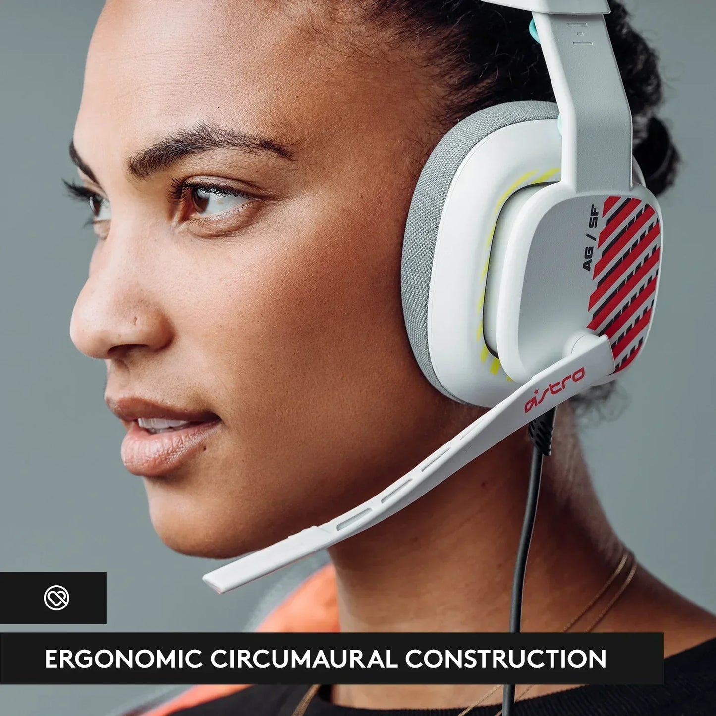 Close-up of a woman wearing white Astro AG SF ergonomic circumaural gaming headset with mic