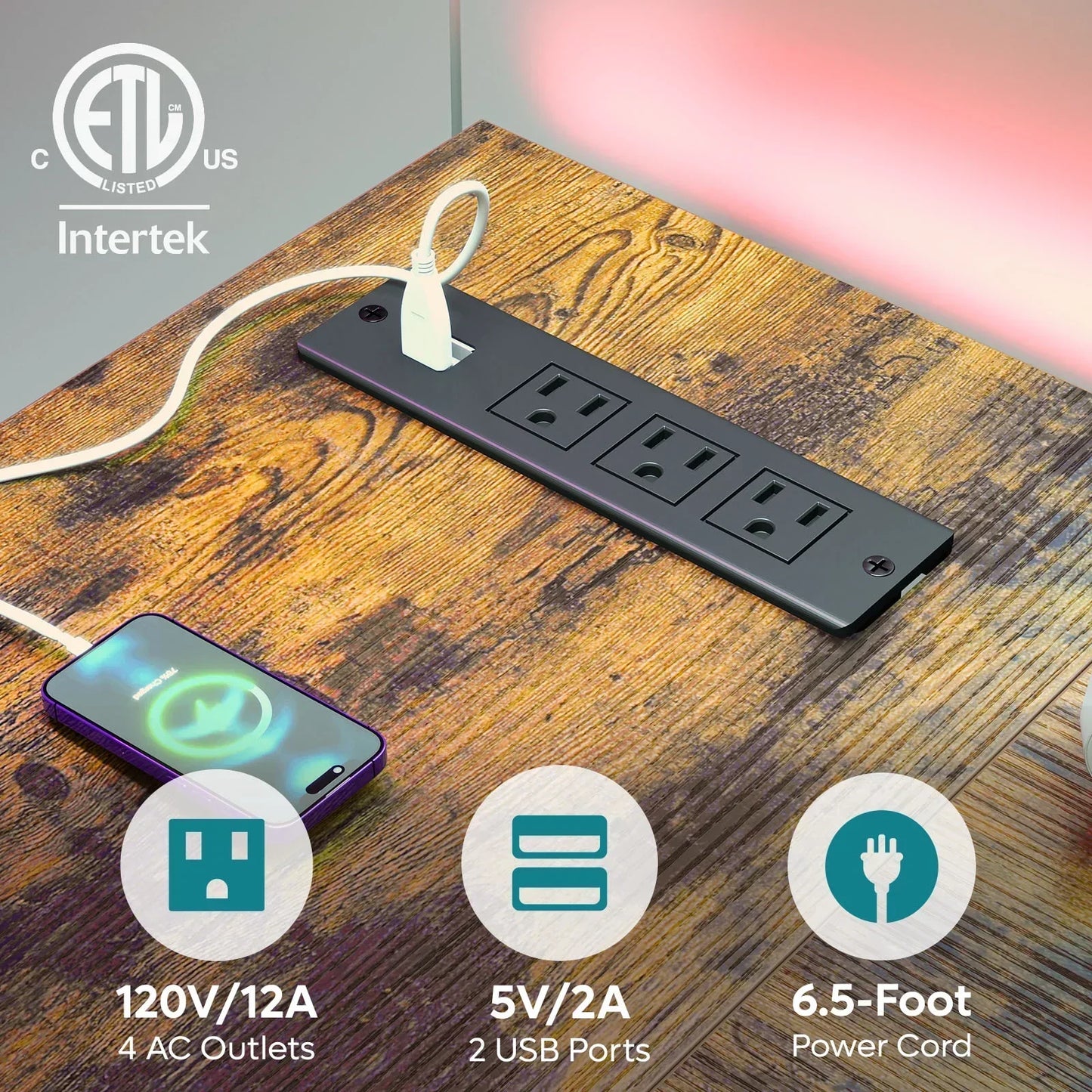 Black power strip with 4 AC outlets and 2 USB ports on wood desk, charging smartphone