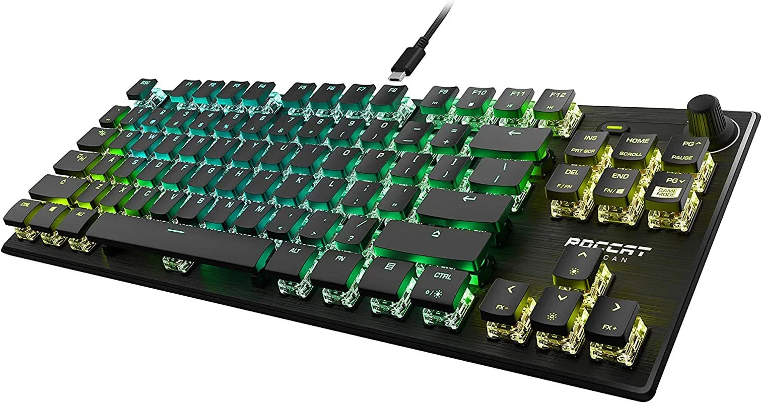 RGB mechanical gaming keyboard with transparent switches and black keycaps on black desk