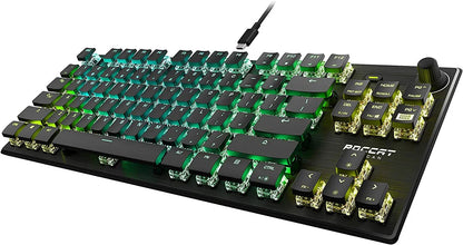 RGB mechanical gaming keyboard with transparent switches and black keycaps on black desk