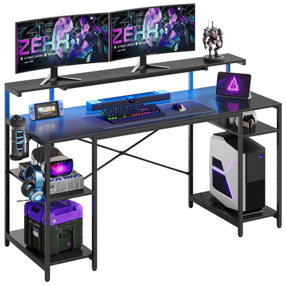 Modern gaming desk setup with dual Alienware monitors, RGB keyboard and mouse, gaming PC, headset, and gaming accessories