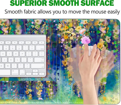 Floral-themed gaming mouse pad with smooth surface, wrist rest, and white keyboard, hand using mouse