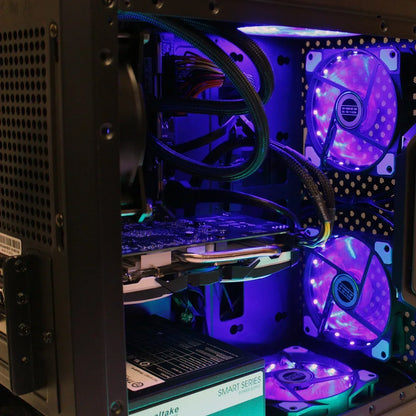 Custom gaming PC interior with RGB LED fans, graphics card, and power supply