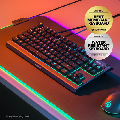 SteelSeries Apex 3 TKL RGB water resistant gaming keyboard on RGB mousepad, desk setup