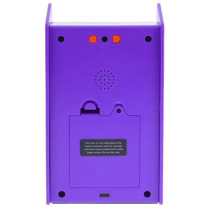 Back view of purple retro 8-bit gaming console with battery compartment and USB-C port