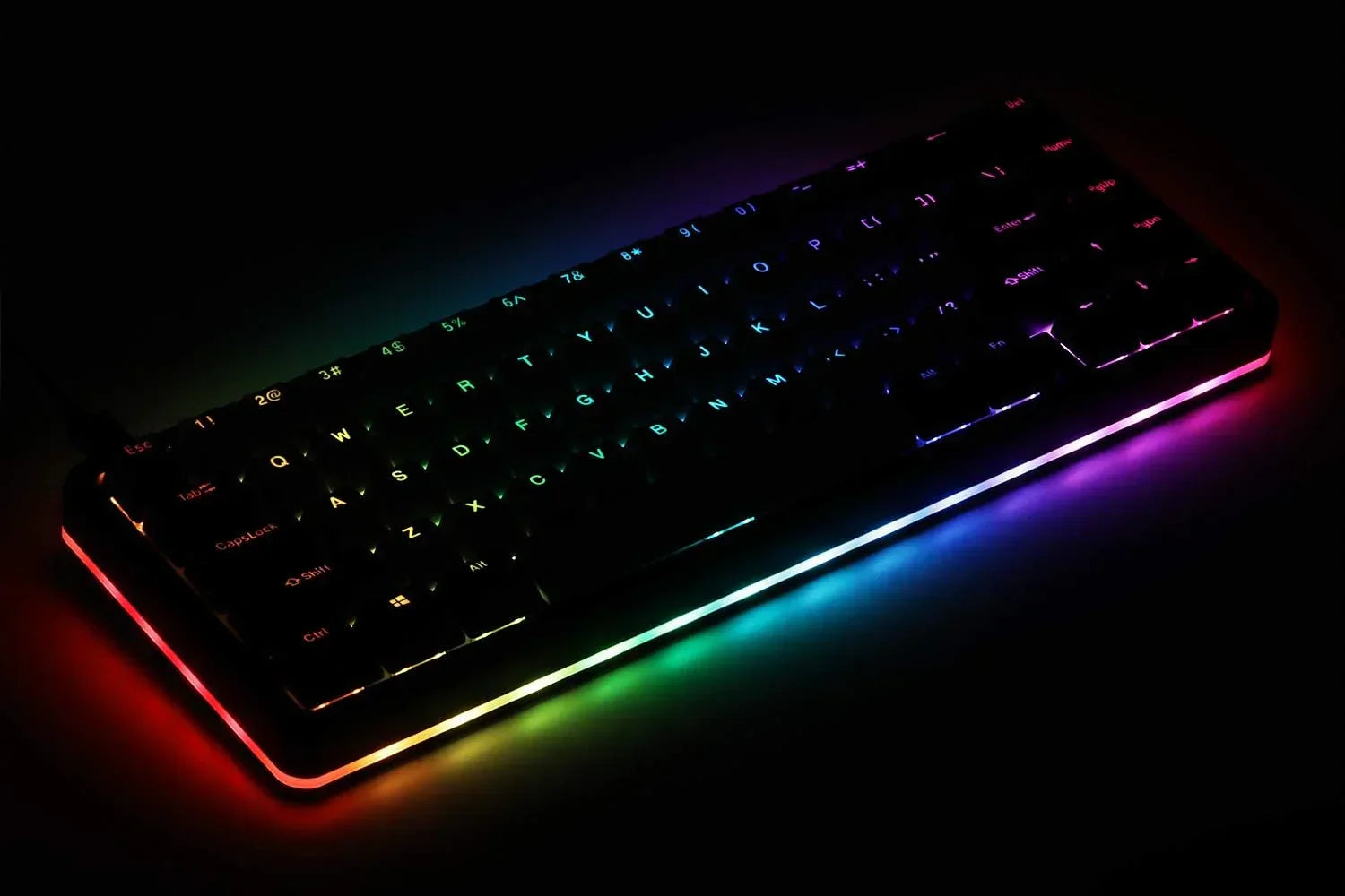 RGB-backlit mechanical gaming keyboard with vibrant rainbow lighting on dark background