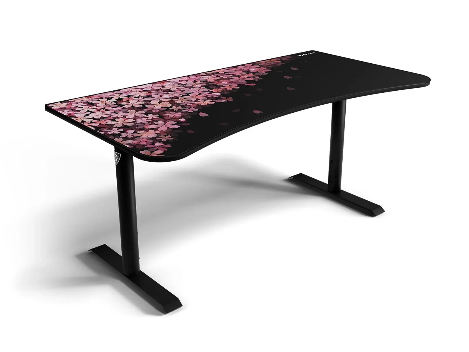 Curved black gaming desk with pink cherry blossom petal design and sturdy black metal legs