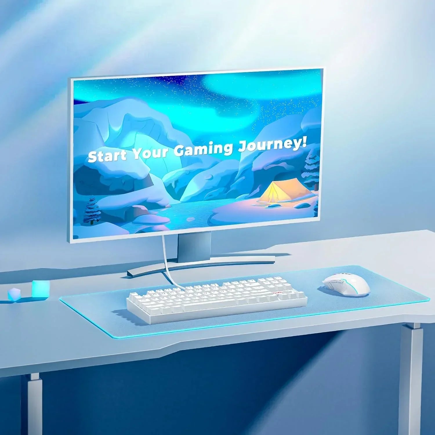 Modern gaming desk setup with RGB keyboard, mouse, and monitor displaying 'Start Your Gaming Journey!'