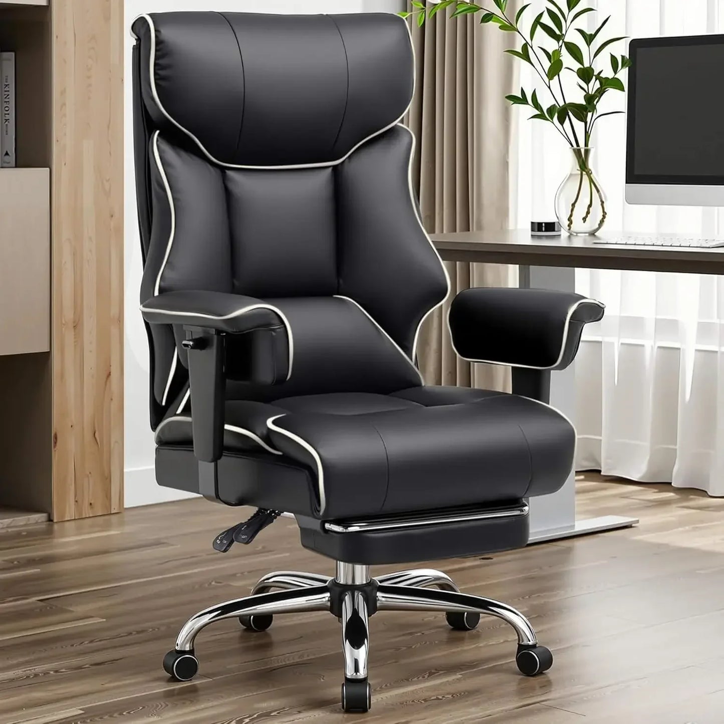 Black gaming office chair with white stitching, lumbar support, and footrest in modern workspace