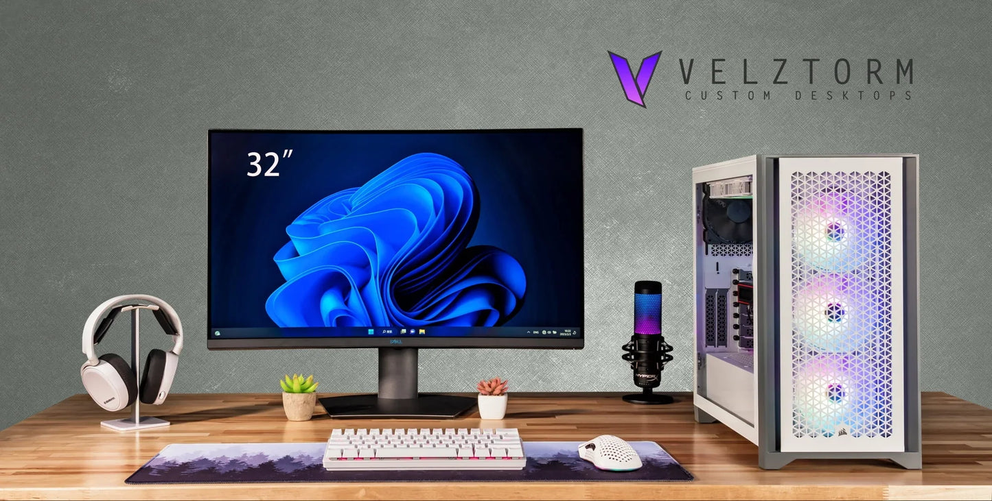Modern gaming setup with 32-inch monitor, custom RGB-lit Velztorm desktop, mechanical keyboard, gaming mouse, mic, and headphones on wooden desk
