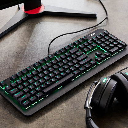 RGB gaming keyboard and headset on desk with monitor stand, Byte Style modern gaming gear