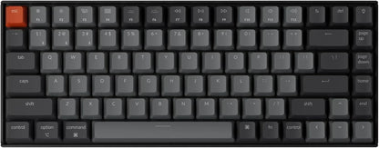 Compact RGB mechanical keyboard with dark gray keycaps and orange escape key, Byte Style gaming gear.