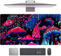 Brightly colored gaming desk mat with neon pink and blue psychedelic mushroom design beneath monitor, keyboard, and mouse