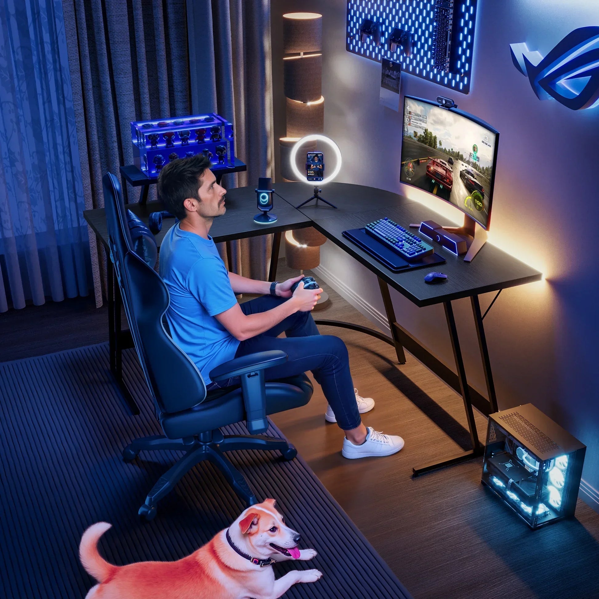 Man in blue shirt gaming on a curved monitor with RGB keyboard in a modern setup, dog nearby