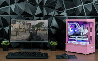 Gaming PC setup with pink RGB desktop, GeForce RTX, monitor, keyboard, and mouse.