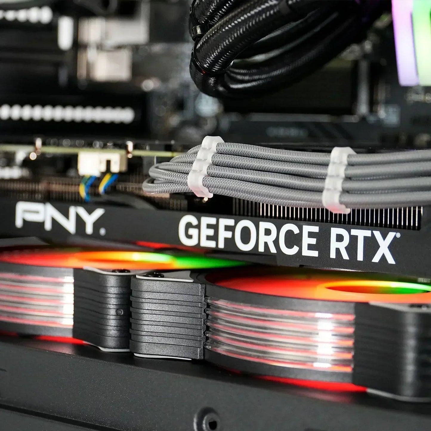 Close-up of PNY GeForce RTX graphics card with RGB lighting inside gaming PC