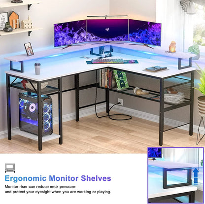 White L-shaped gaming desk with ergonomic monitor shelf, triple screens, LED keyboard, and PC tower