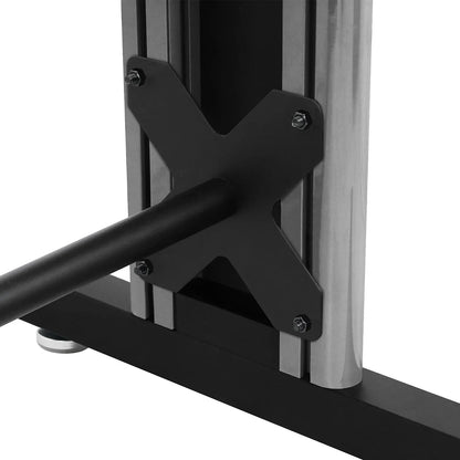 Close-up of metal cross bracket with bolts on exercise machine frame
