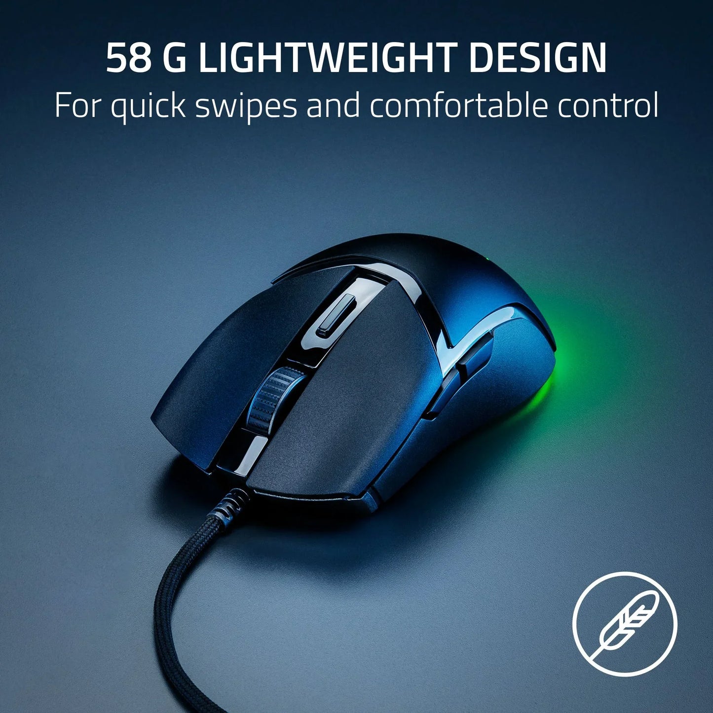 Black lightweight wired gaming mouse with braided cable and green light on dark surface