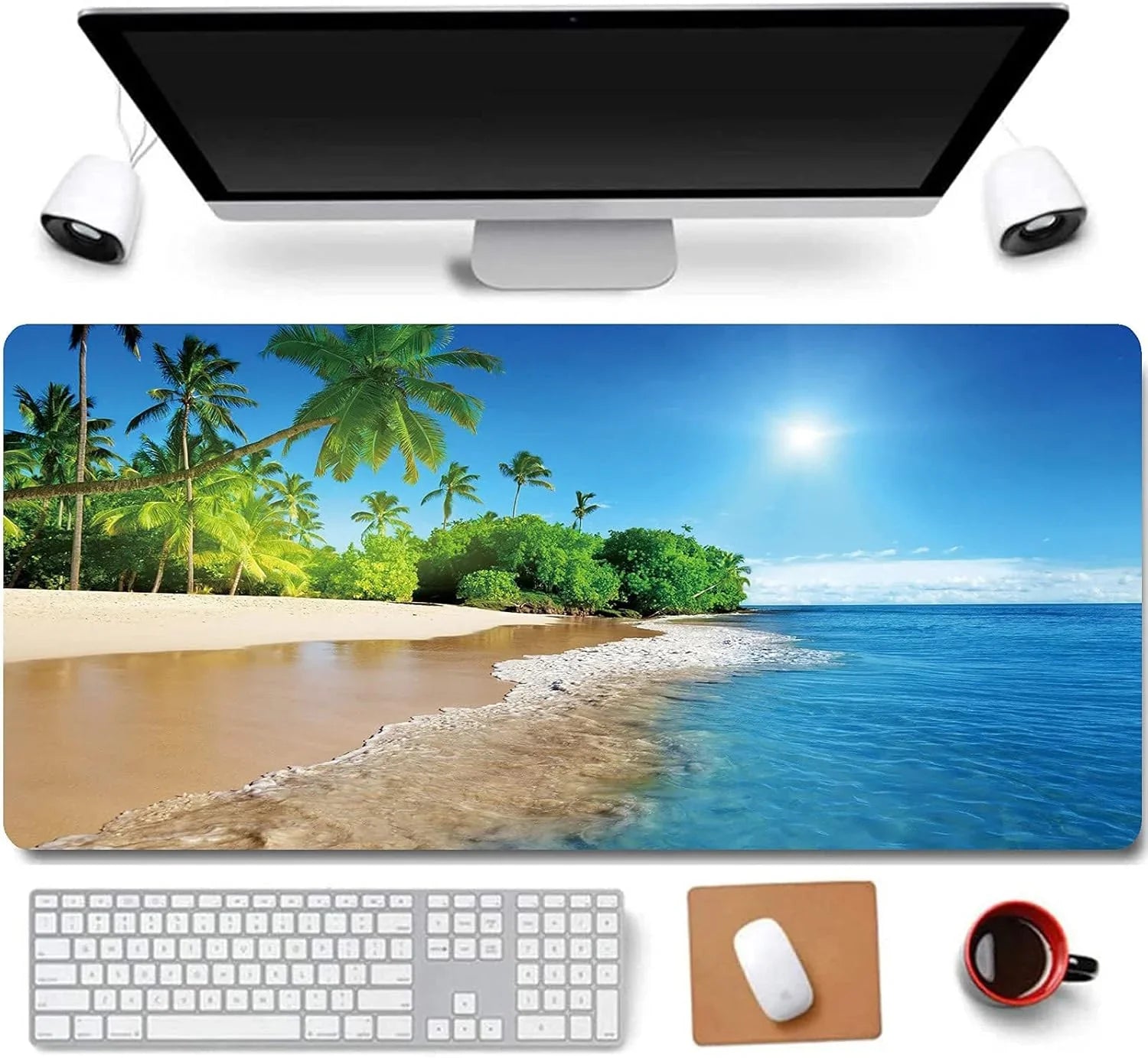 Desk setup with widescreen monitor, tropical beach-themed mouse pad, keyboard, mouse on brown pad, and black coffee cup