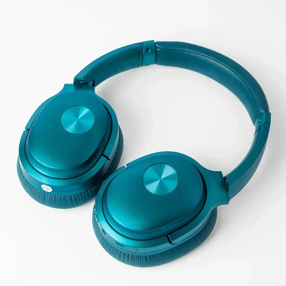 Teal over-ear wireless gaming headset with padded ear cups on a white background