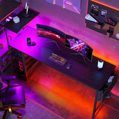Modern gaming desk setup with dual curved monitors, RGB lighting, gaming keyboard, mouse, and ergonomic chair