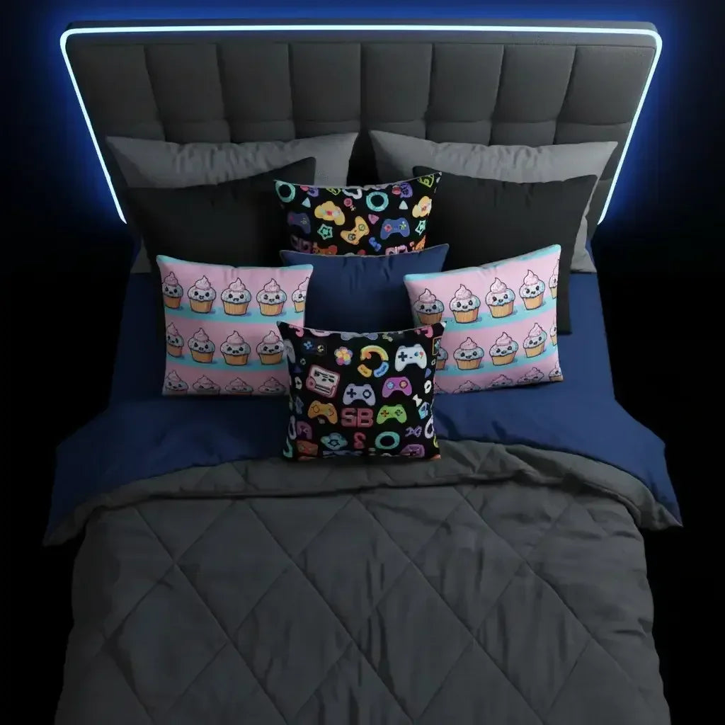 Modern bed with dark gray headboard, blue and gray bedding, and colorful gaming and cupcake themed pillows