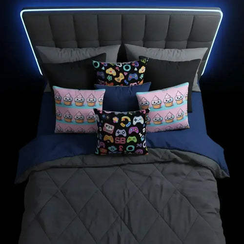 Modern bed with dark gray headboard, blue and gray bedding, and colorful gaming and cupcake themed pillows
