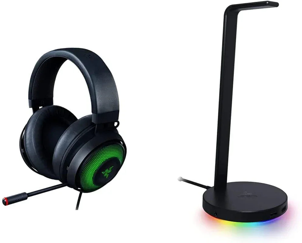 Gaming headset with green RGB lighting and microphone next to black RGB headset stand
