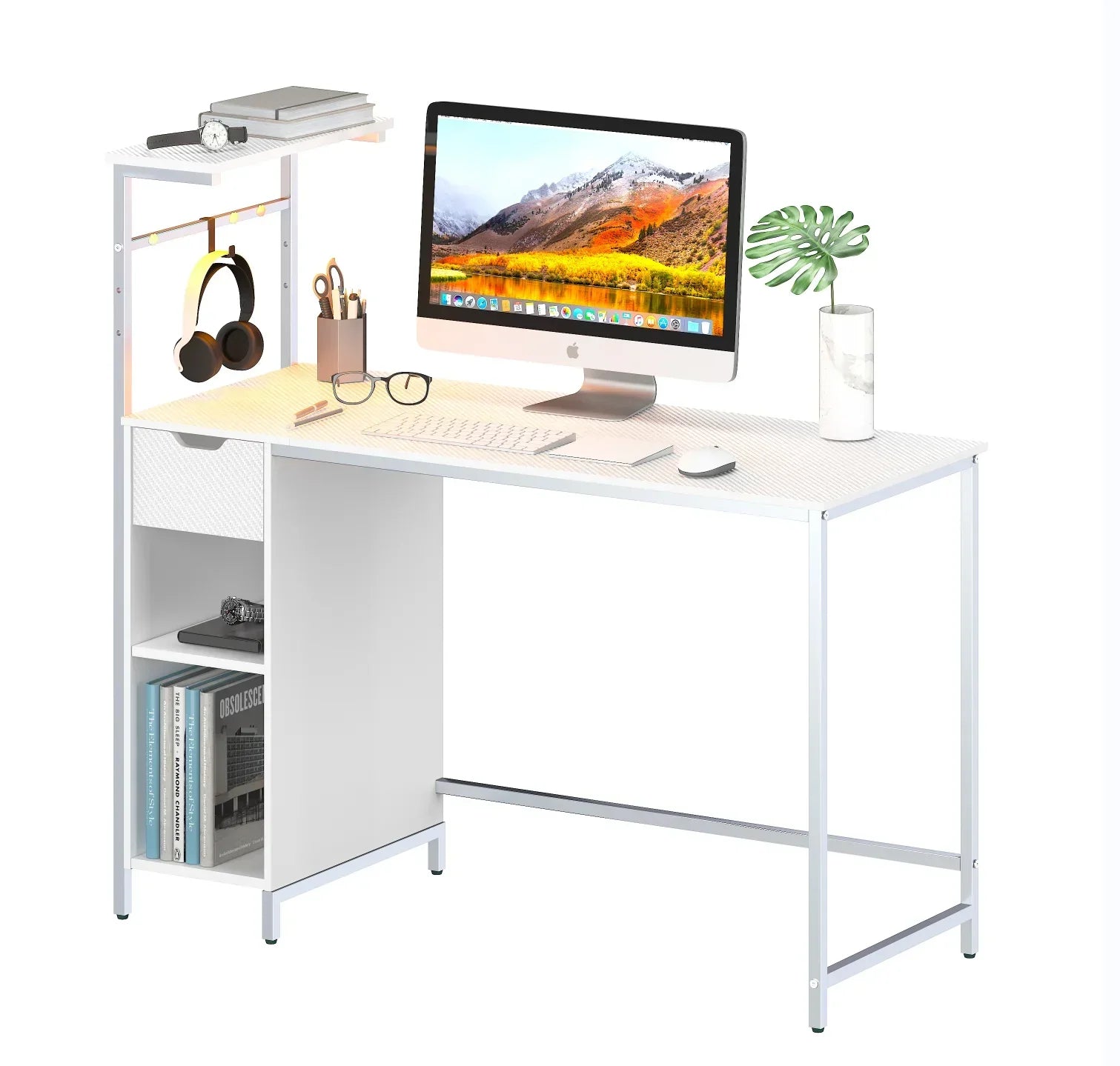 Modern white office desk with iMac, wireless keyboard and mouse, books, glasses, headphones, and plant