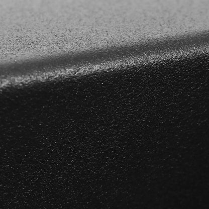 Close-up of textured black anti-slip surface with curved edge