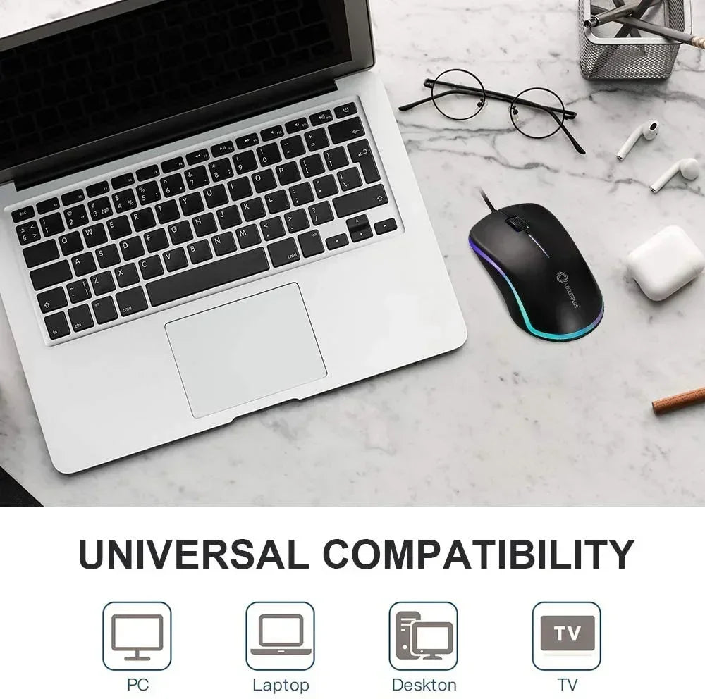 Wired RGB gaming mouse beside laptop on marble desk, showing universal compatibility.