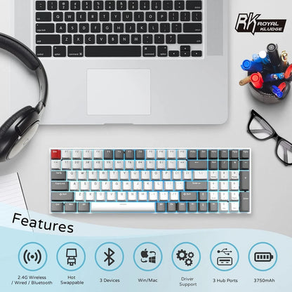 Mechanical keyboard with RGB backlight, wireless Bluetooth, hot swappable keys, shown with laptop, headset, glasses, and pens