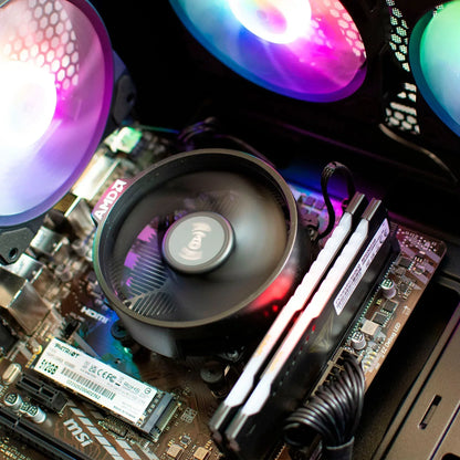 Close-up of a gaming PC motherboard with AMD CPU cooler, RGB fans, RAM, and SSD installed