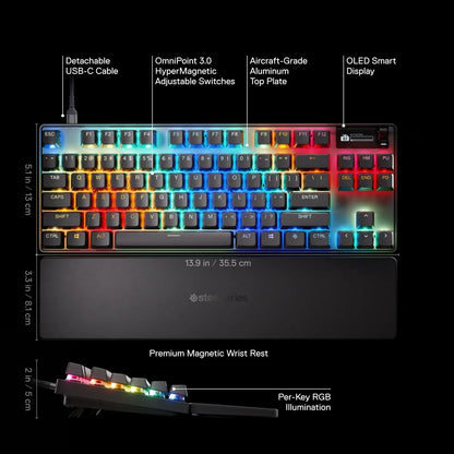RGB gaming keyboard with wrist rest, OLED display, aluminum top, and adjustable switches.