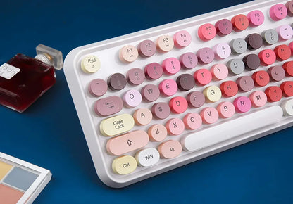 Retro pastel mechanical keyboard with round keycaps on blue desk, Byte Style gaming gear