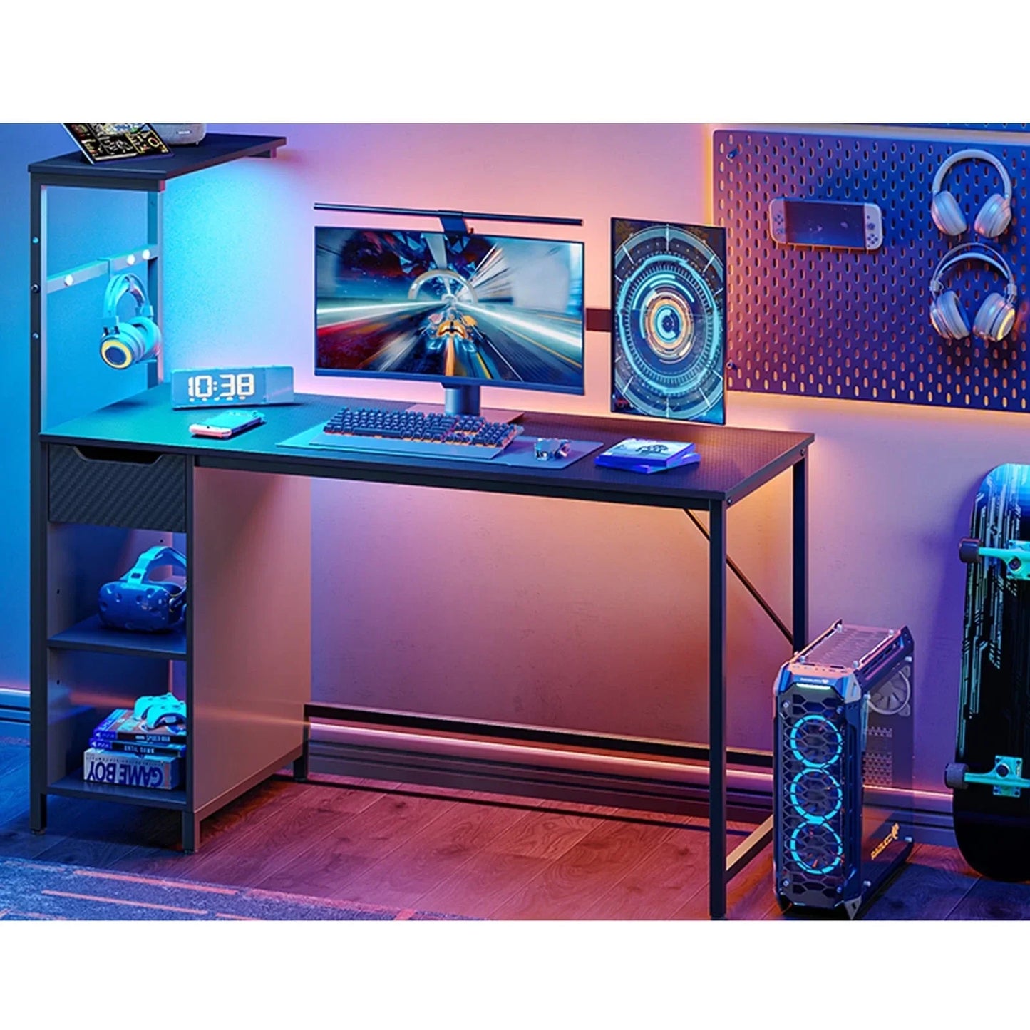Modern gaming setup with dual monitors, mechanical keyboard, headphones, VR headset, and RGB-lit PC tower on wooden floor