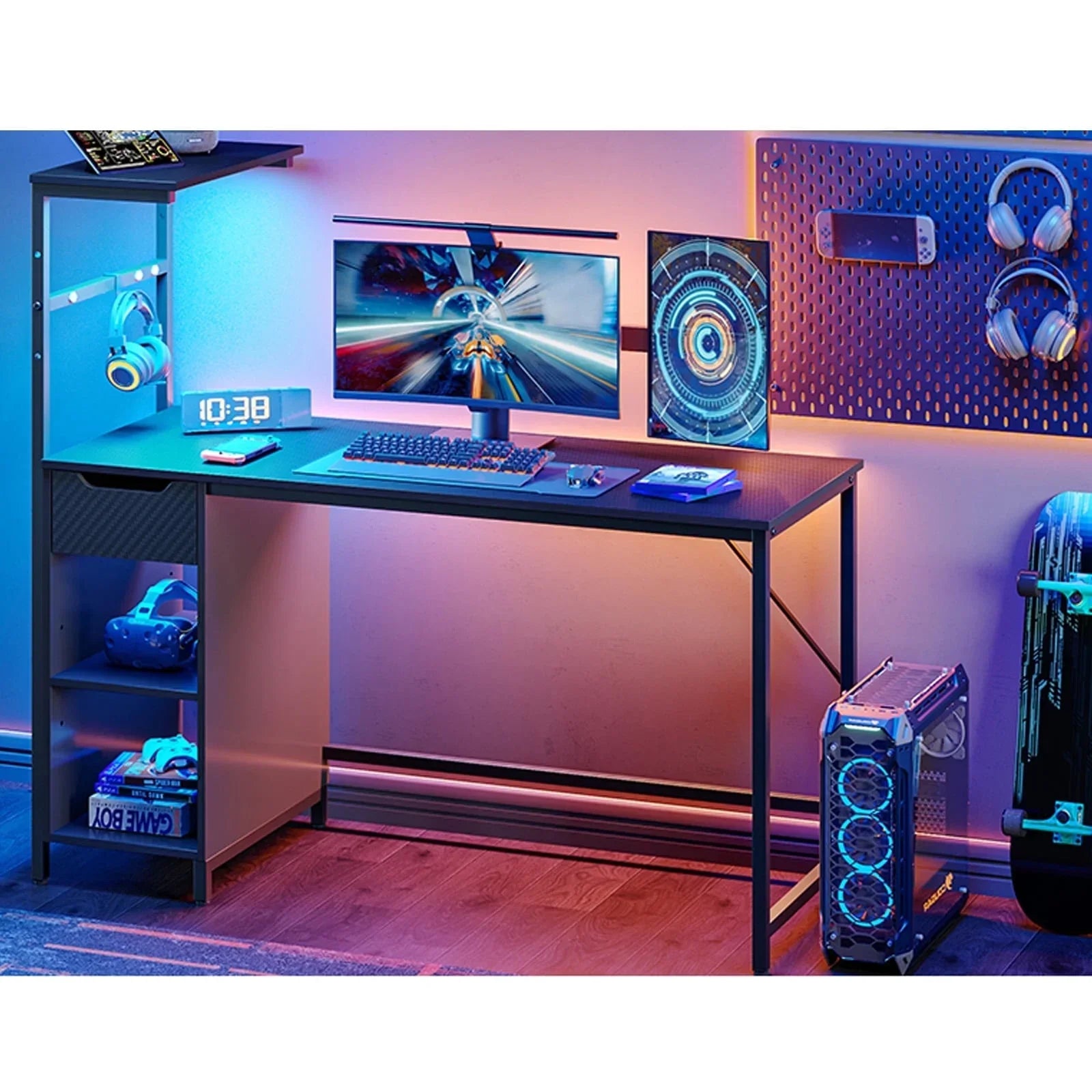 Modern gaming setup with dual monitors, mechanical keyboard, headphones, VR headset, and RGB-lit PC tower on wooden floor