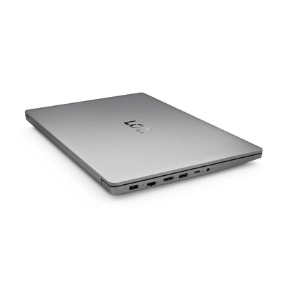Closed silver gaming laptop showing multiple ports on white background