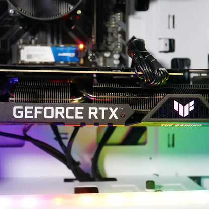 Close-up of ASUS TUF Gaming GeForce RTX graphics card inside a gaming PC with RGB lighting