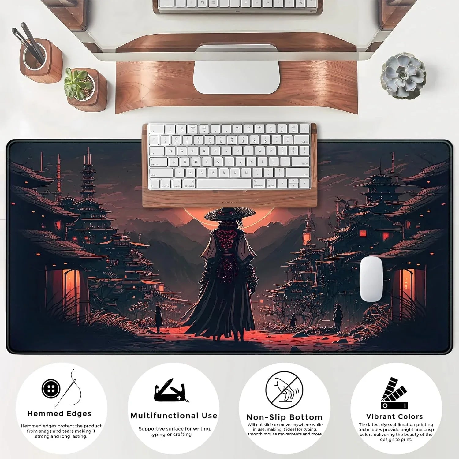 Large gaming mouse pad with samurai warrior art, keyboard, white mouse, and desk accessories