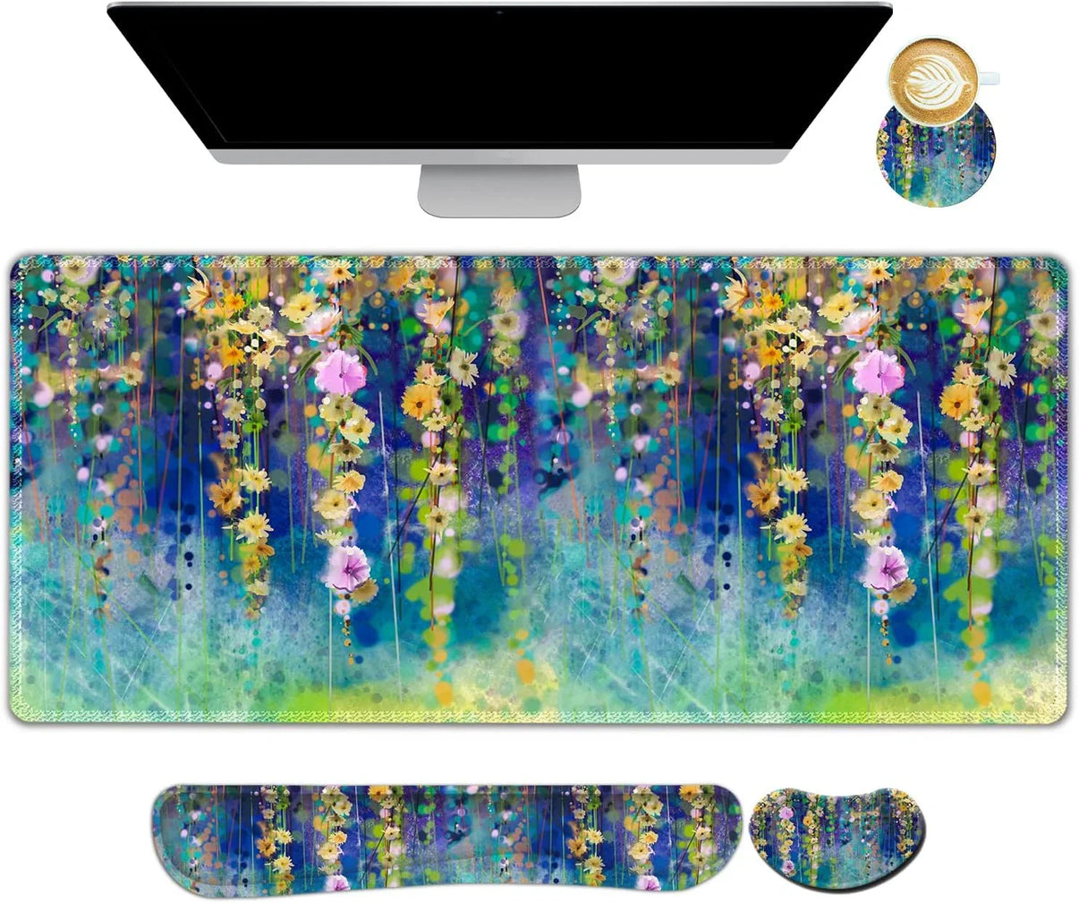 Colorful floral gaming desk mat with matching wrist rest and mouse pad under computer monitor and coffee cup