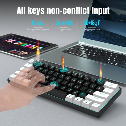 Compact mechanical keyboard with 61 keys, shown beside a laptop and tablet on a desk, Byte Style gaming gear.