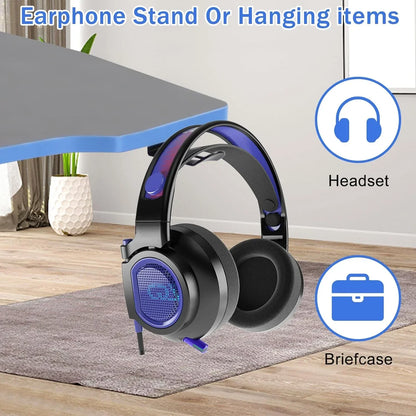 Black and blue gaming headset hanging from desk edge in modern room with icons for headset and briefcase